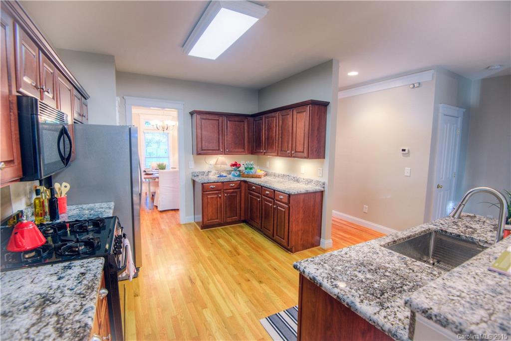 915 Derricks Crossing Fort Mill, SC 29708 - Photo 9 of 24 a kitchen with stainless steel appliances granite countertop a sink stove and refrigerator