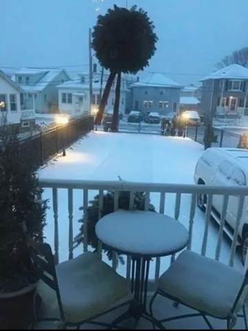 a kitchen with granite countertop a refrigerator and a sink