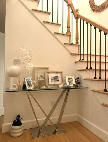a kitchen with a sink a refrigerator and cabinets