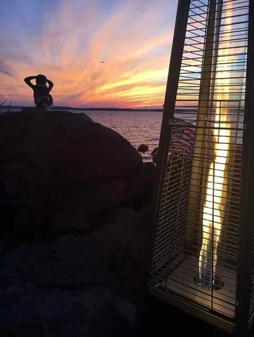 a view of terrace with lawn chairs