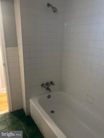 a utility room with two washing machine