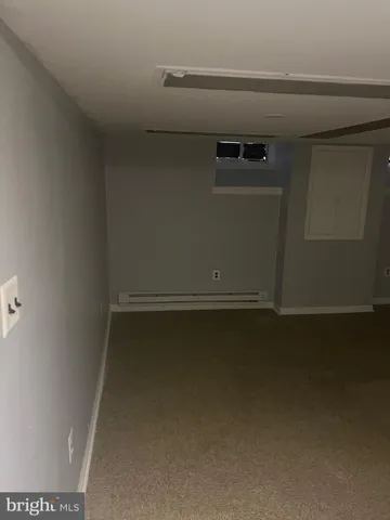 a view of entryway with brick walls