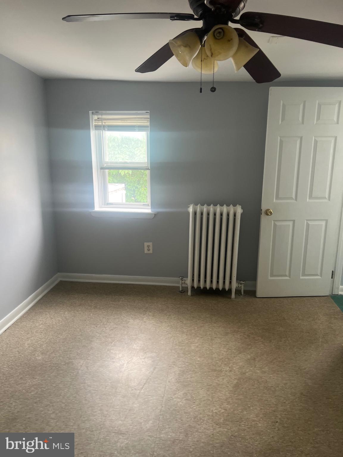 1917 Carpenter Street Philadelphia, PA 19146 - Photo 9 of 28 an empty room with a ceiling fan and window