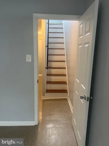 a view of a hallway with stairs