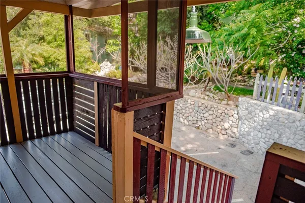 a view of a balcony with wooden floor