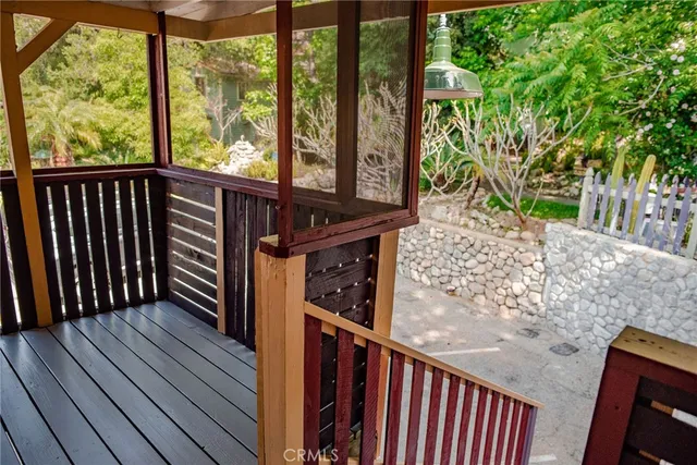 a view of a balcony with wooden floor