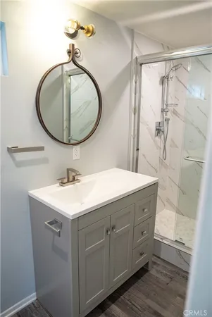 a bathroom with a sink mirror and vanity