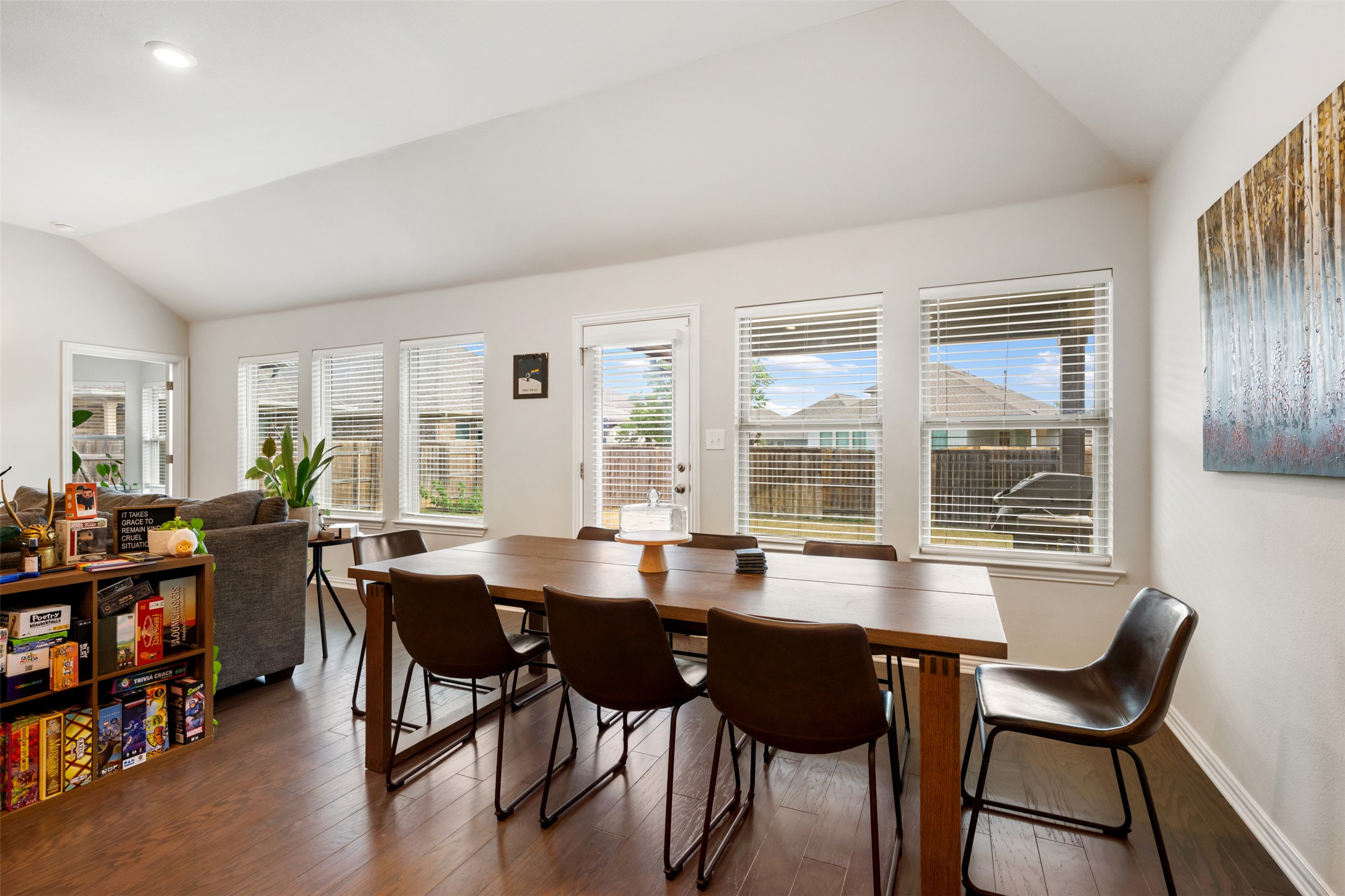 303 Cold Riv Run Kyle, TX 78640 - Photo 13 of 40 Large dining area with a wall of windows overlooking backyard.