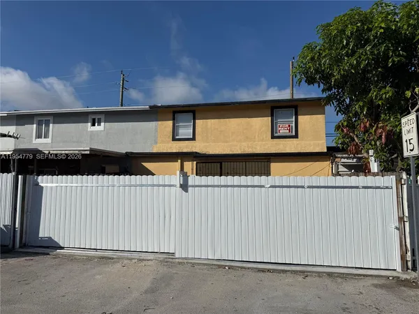 a front view of a house with a garage
