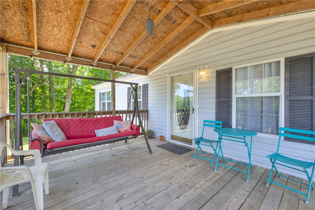 334 Lake Becky Road Mountain Rest, SC 29664 - Photo 5 of 46 A spacious covered porch invites relaxation with ample room for seating and outdoor enjoyment.