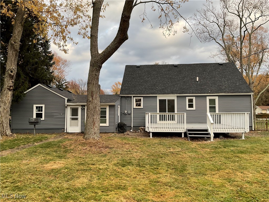 8002 Stockbridge Road Mentor, OH 44060 - Photo 19 of 19 Back of house featuring a yard, roof with shingles, and a deck