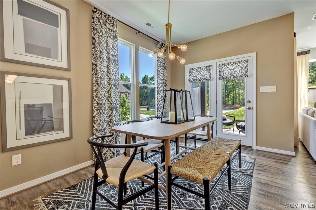 12707 Deep Well Road Midlothian, VA 23112 - Photo 15 of 50 a view of a dining room with furniture window and wooden floor