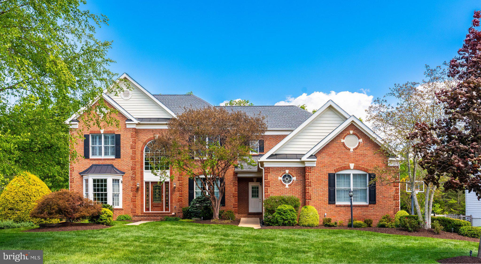 25554 Mimosa Tree Court Chantilly, VA 20152 - Photo 1 of 85 front view of house with a yard