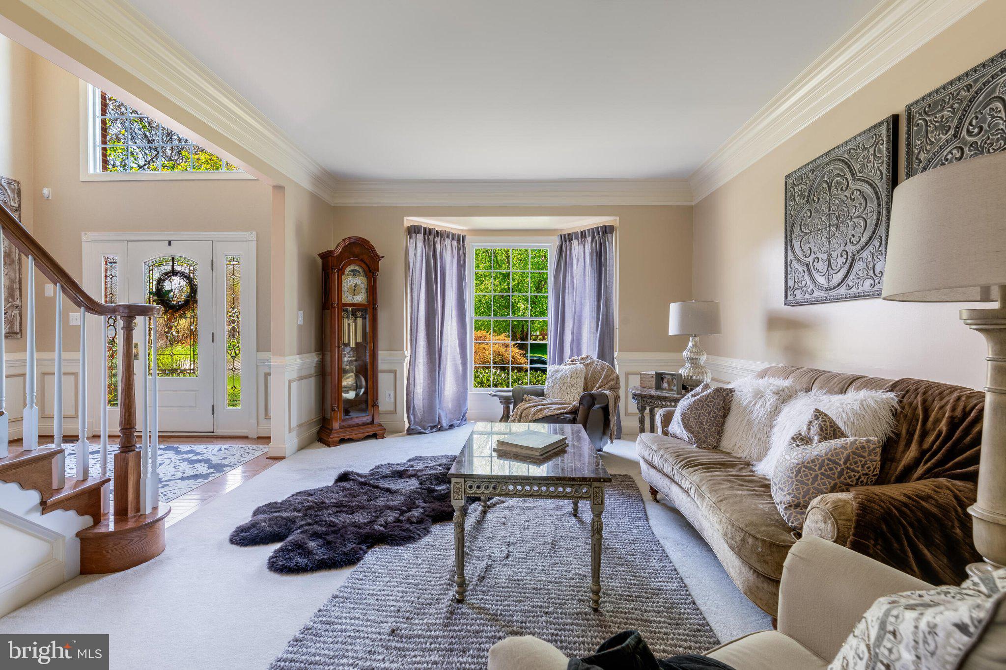 25554 Mimosa Tree Court Chantilly, VA 20152 - Photo 12 of 85 a living room with furniture and a large window