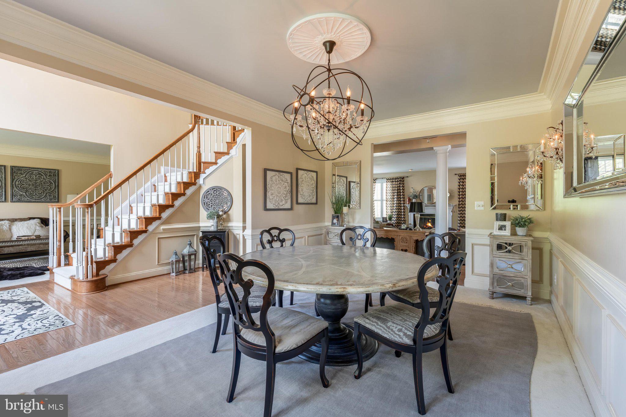 25554 Mimosa Tree Court Chantilly, VA 20152 - Photo 13 of 85 Elegant dining space with staircase charm.