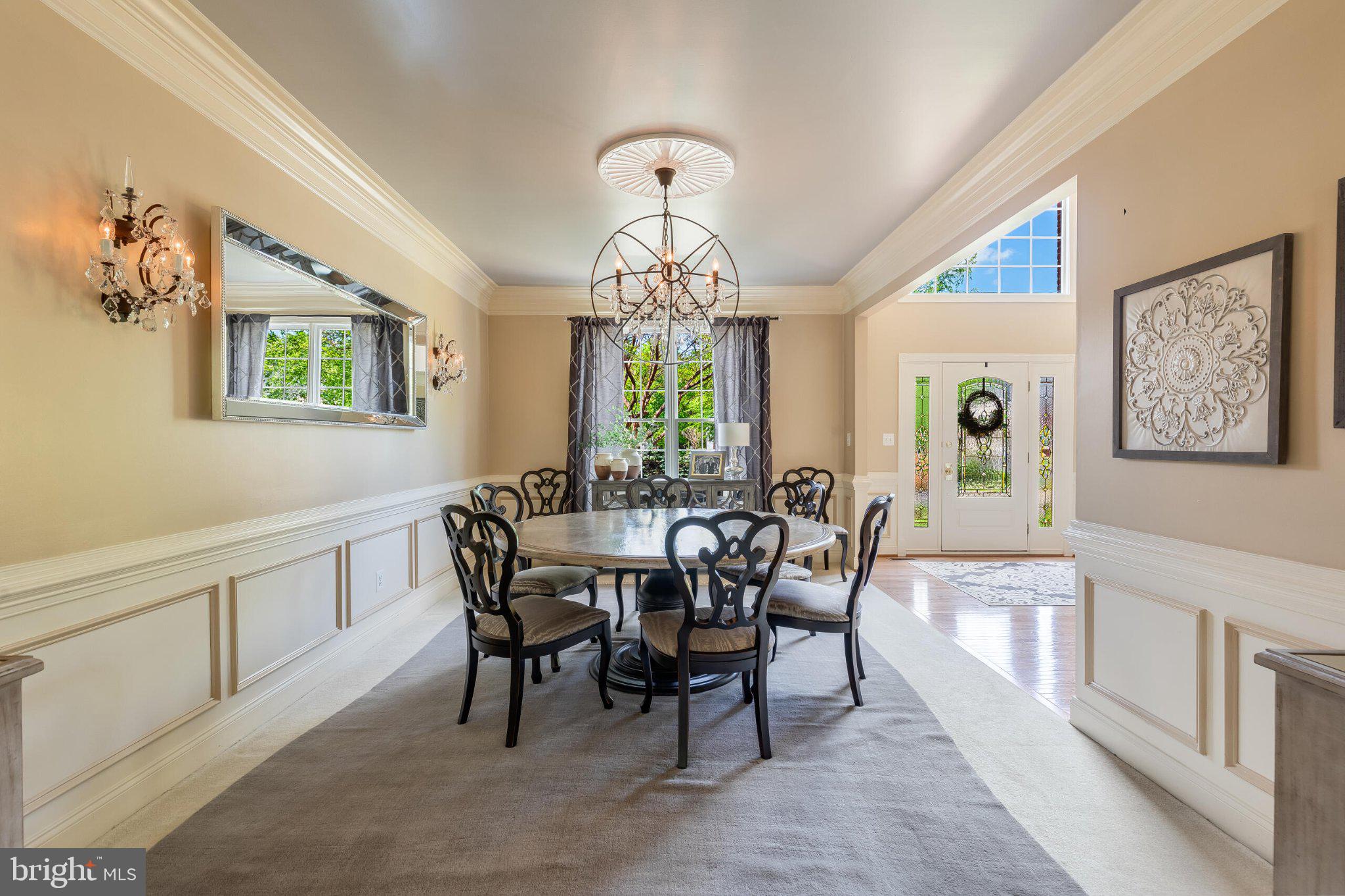 25554 Mimosa Tree Court Chantilly, VA 20152 - Photo 14 of 85 a view of a dining room with furniture window and chandelier