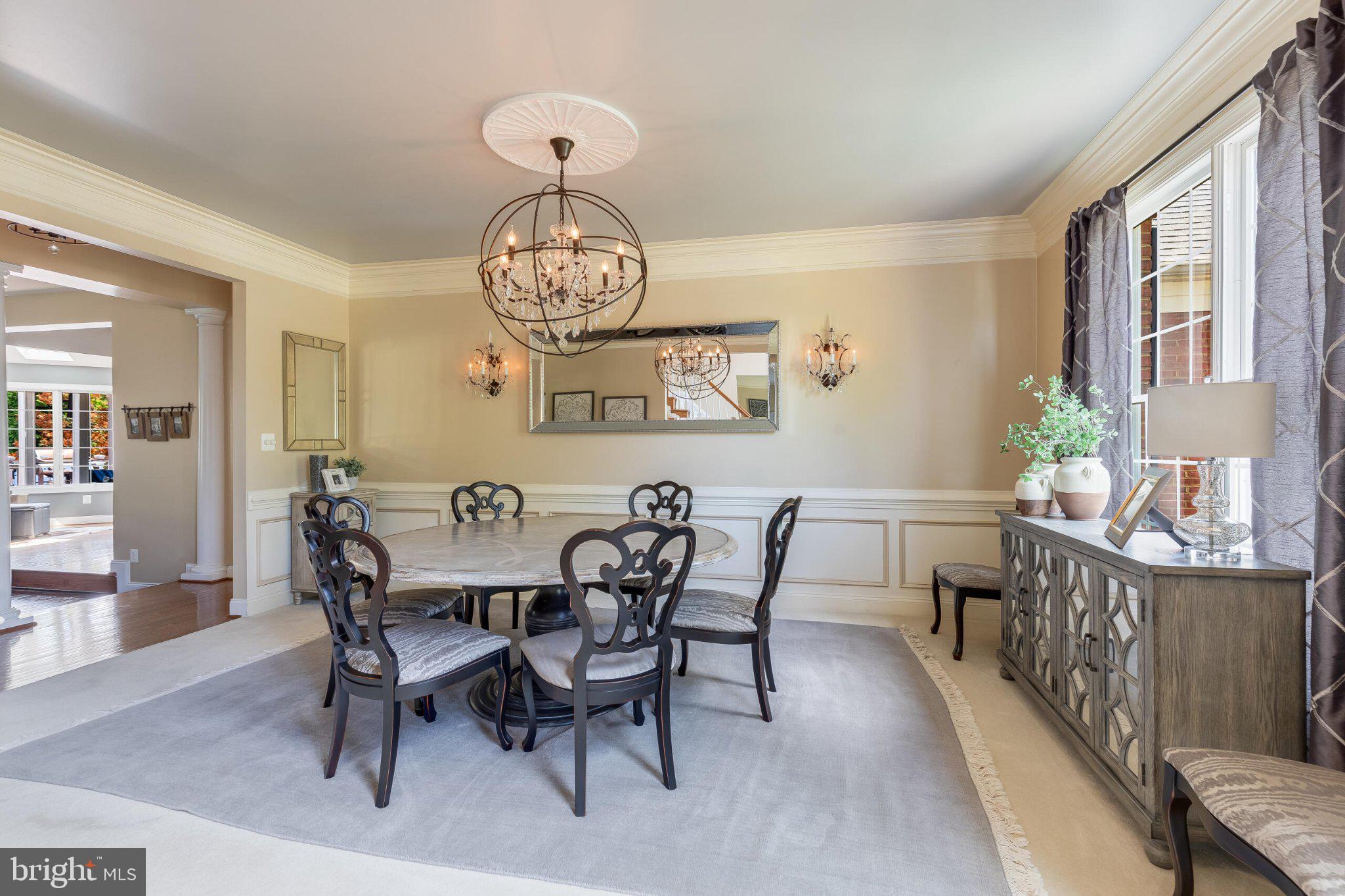 25554 Mimosa Tree Court Chantilly, VA 20152 - Photo 15 of 85 a view of a dining room with furniture wooden floor and chandelier