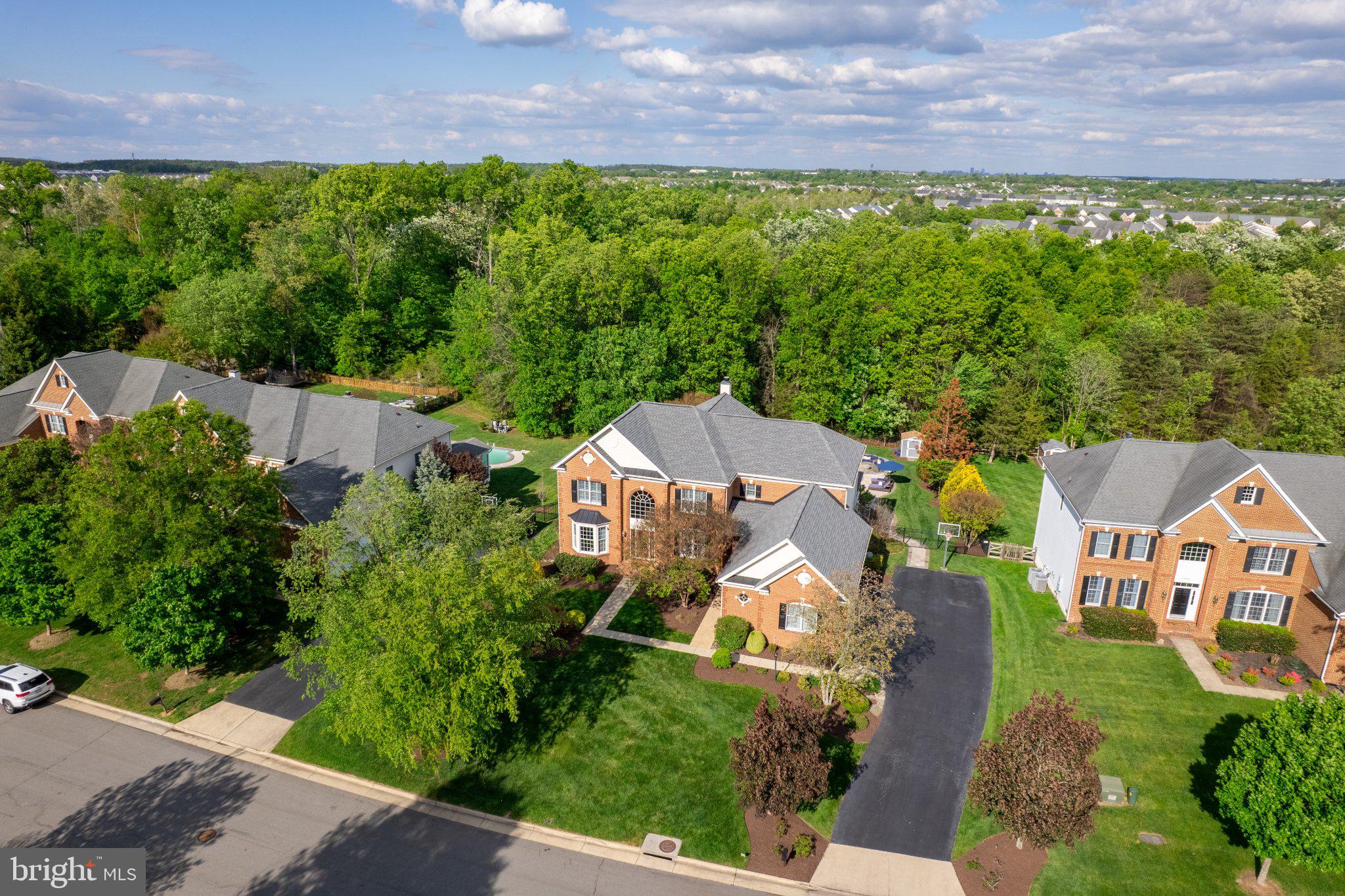 25554 Mimosa Tree Court Chantilly, VA 20152 - Photo 2 of 85 an aerial view of a house with a yard