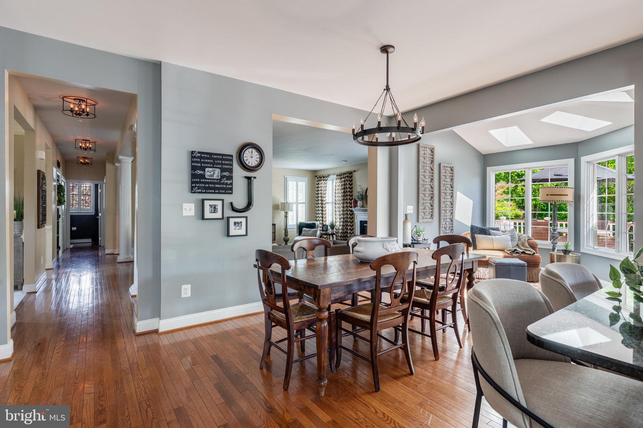 25554 Mimosa Tree Court Chantilly, VA 20152 - Photo 29 of 85 a view of a dining room with furniture window and wooden floor