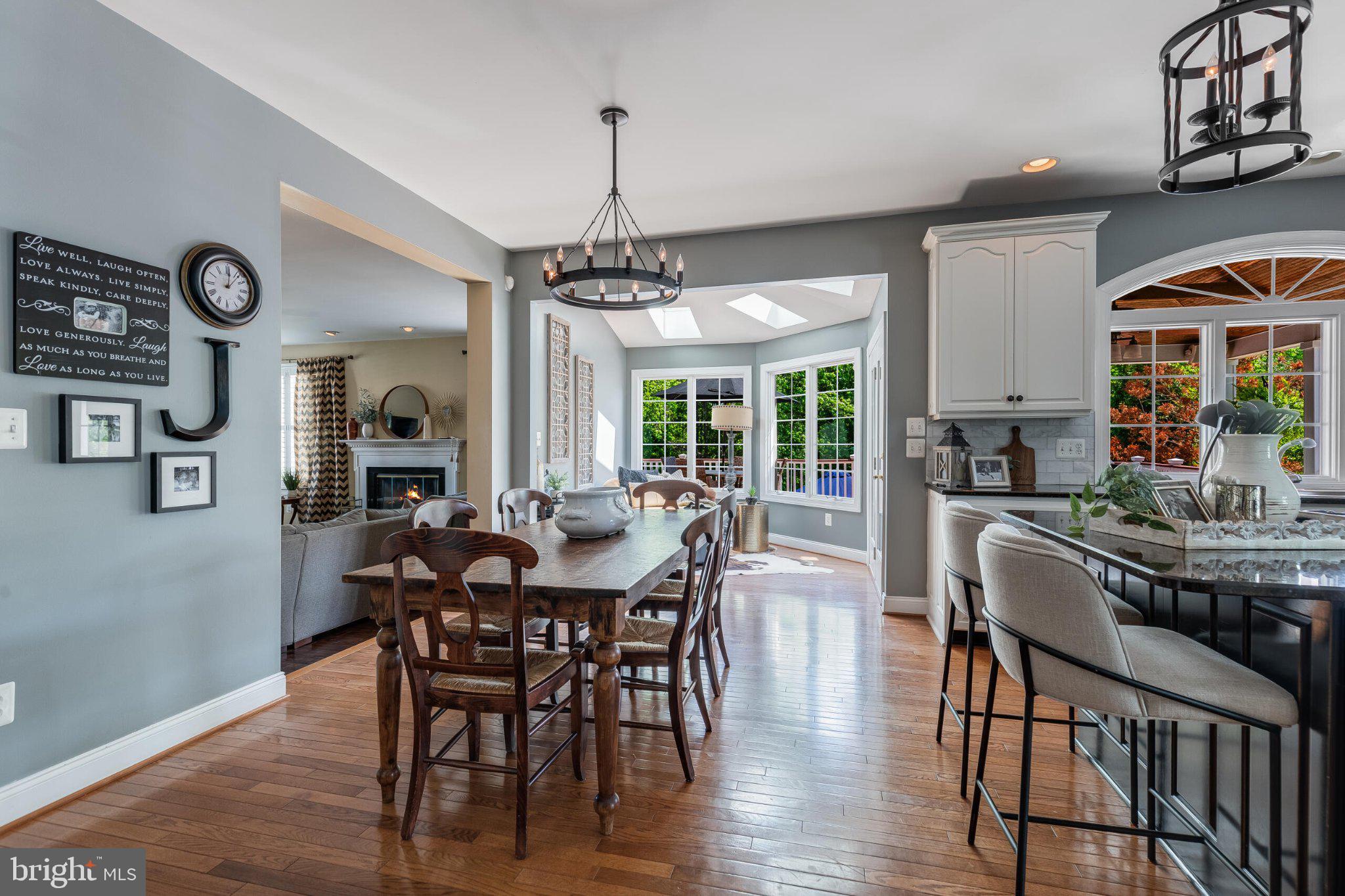 25554 Mimosa Tree Court Chantilly, VA 20152 - Photo 34 of 85 a view of a dining room with furniture window and wooden floor