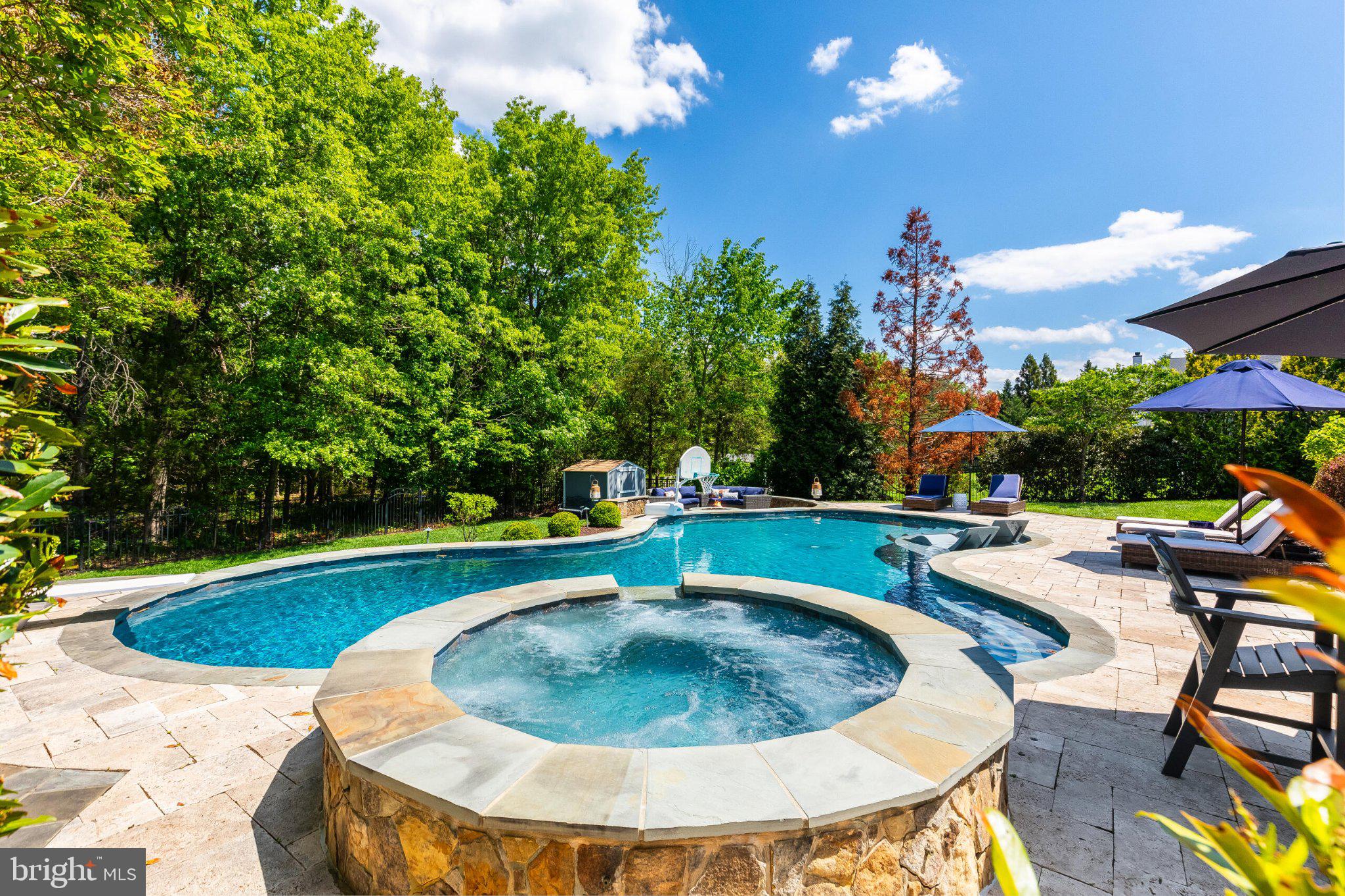25554 Mimosa Tree Court Chantilly, VA 20152 - Photo 40 of 85 a view of a swimming pool with sitting area