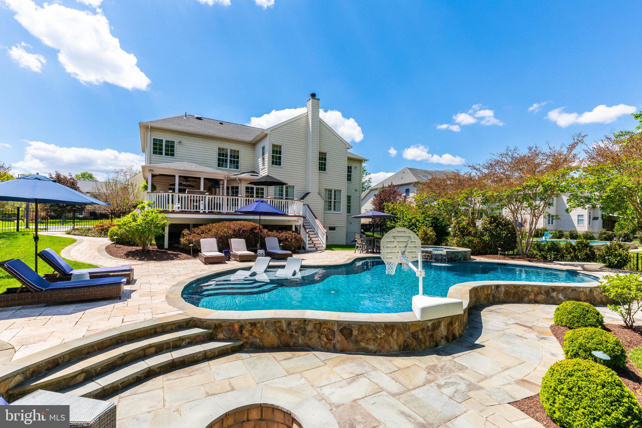 25554 Mimosa Tree Court Chantilly, VA 20152 - Photo 4 of 85 a view of a house with swimming pool and sitting area