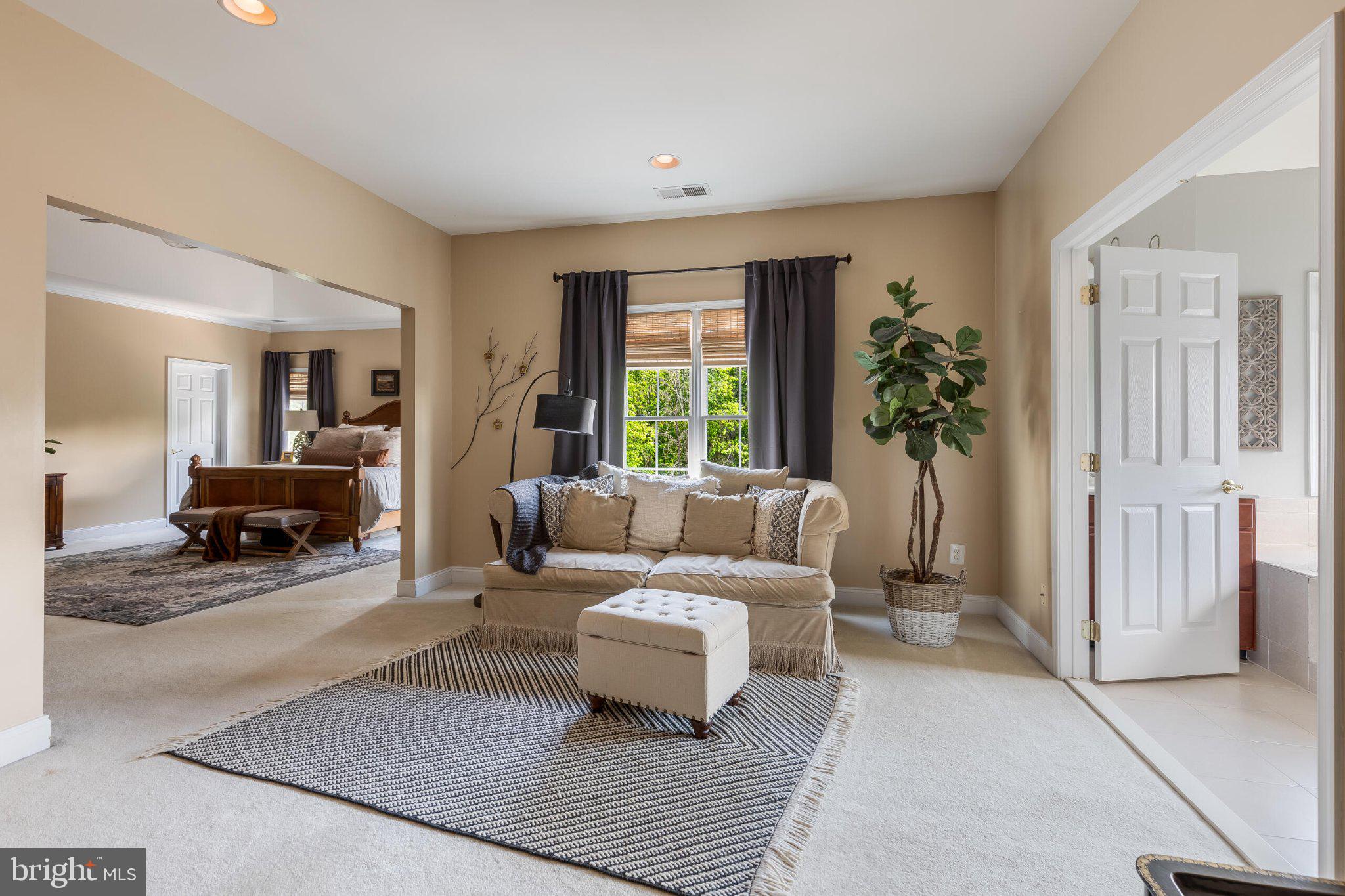 25554 Mimosa Tree Court Chantilly, VA 20152 - Photo 53 of 85 a living room with furniture and a large window