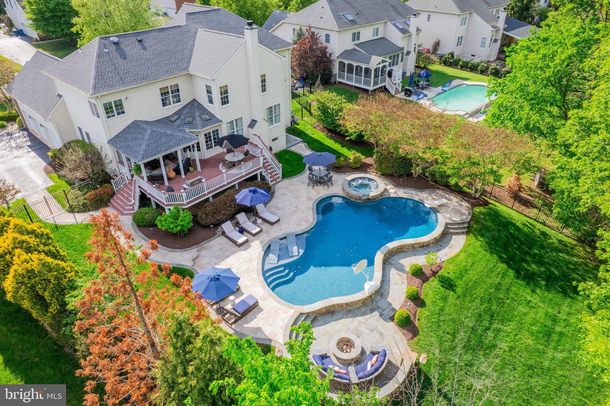 25554 Mimosa Tree Court Chantilly, VA 20152 - Photo 6 of 85 an aerial view of a house with garden space and outdoor seating