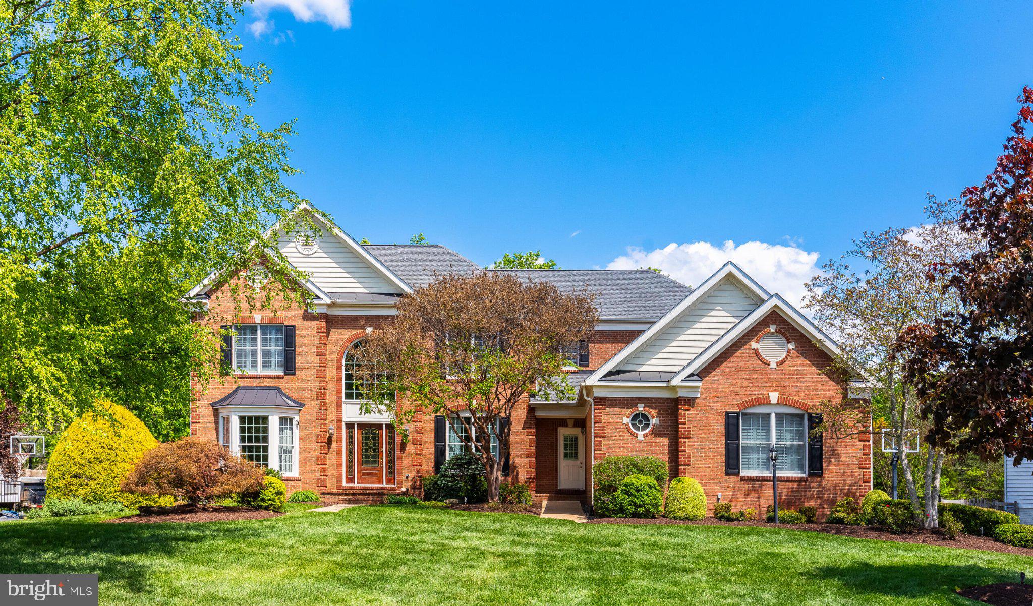 25554 Mimosa Tree Court Chantilly, VA 20152 - Photo 76 of 85 Charming brick home with lush greenery.