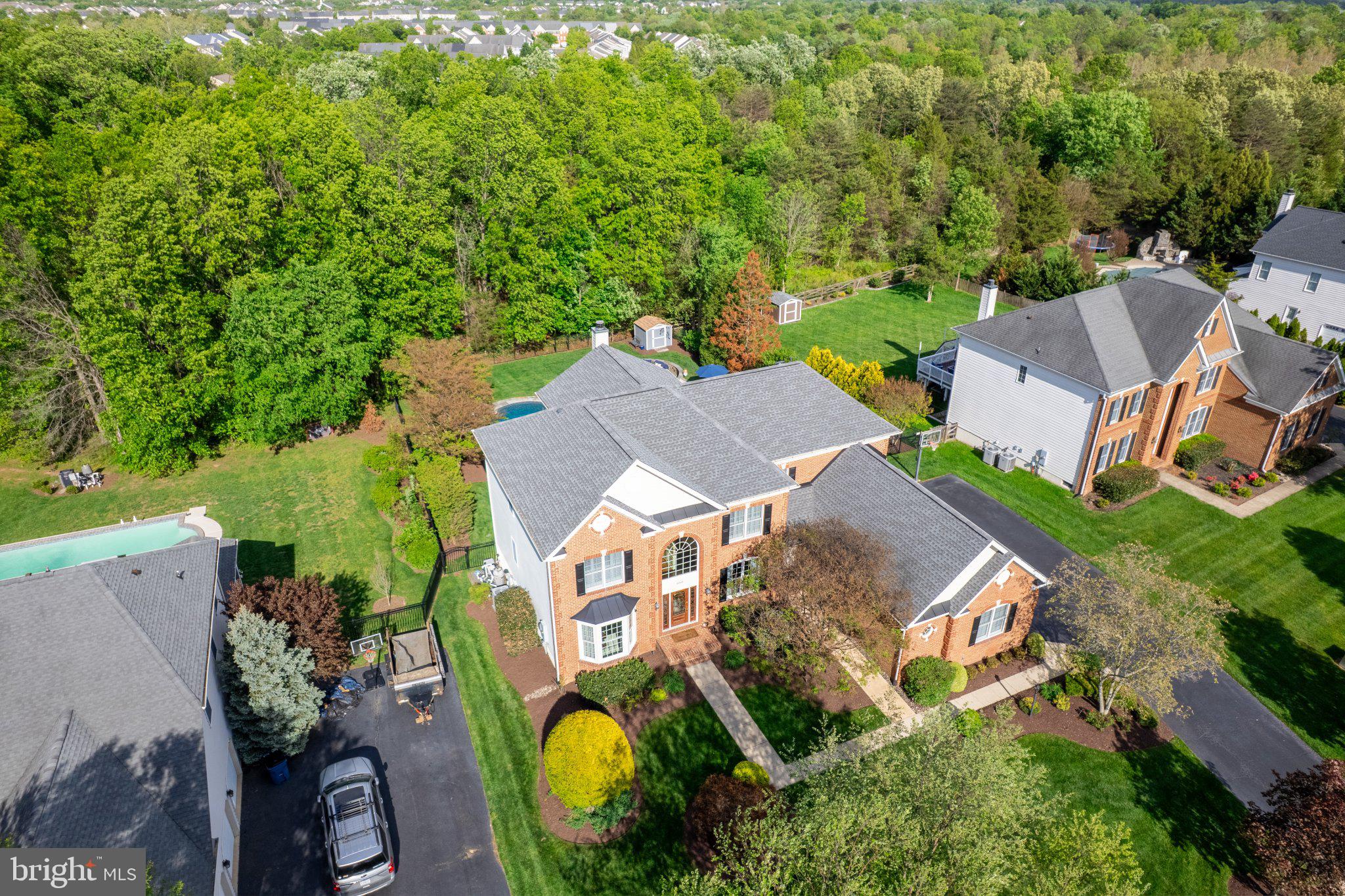 25554 Mimosa Tree Court Chantilly, VA 20152 - Photo 78 of 85 an aerial view of a house with swimming pool and garden view