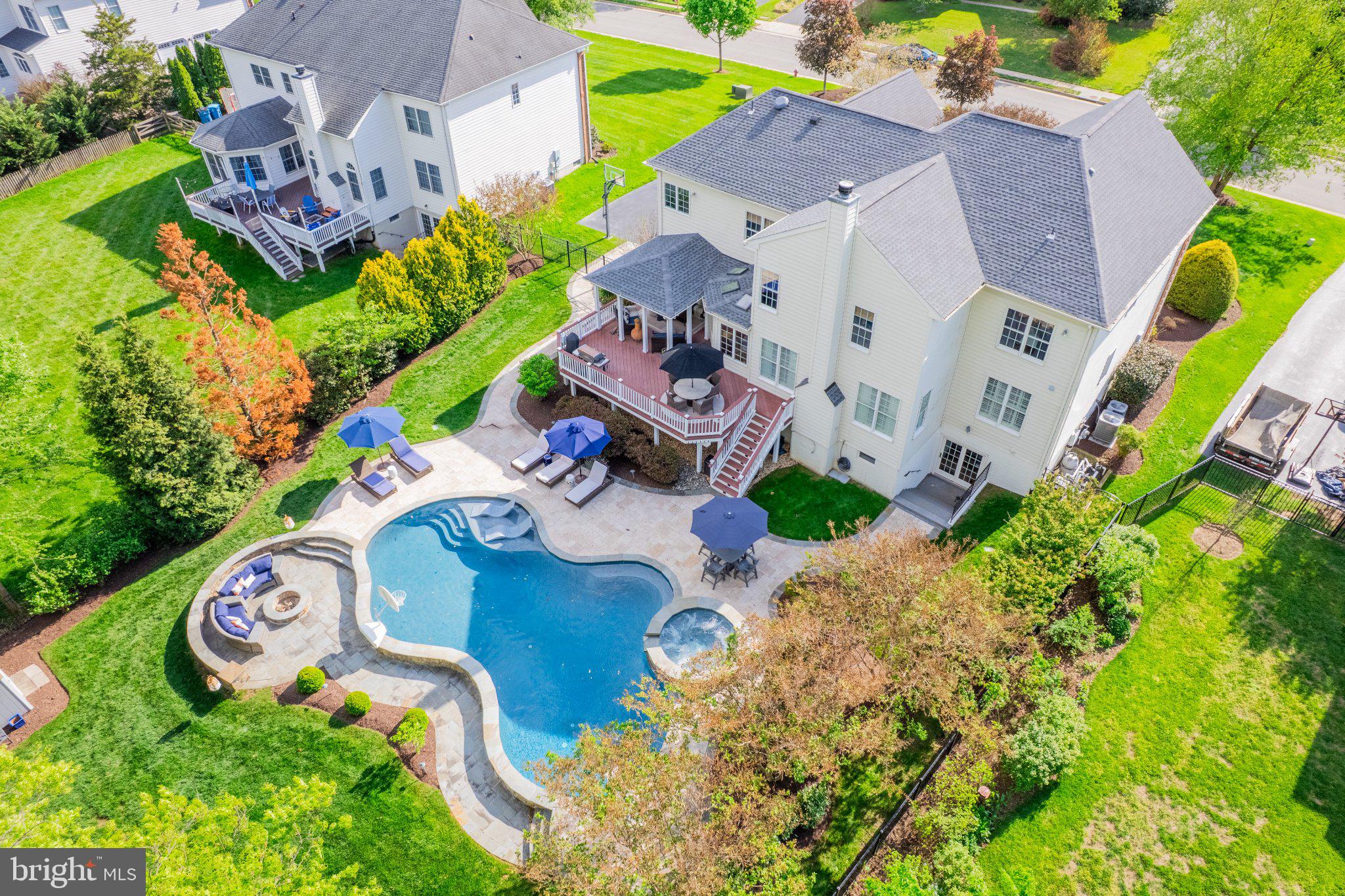 25554 Mimosa Tree Court Chantilly, VA 20152 - Photo 79 of 85 an aerial view of a house with a garden and swimming pool