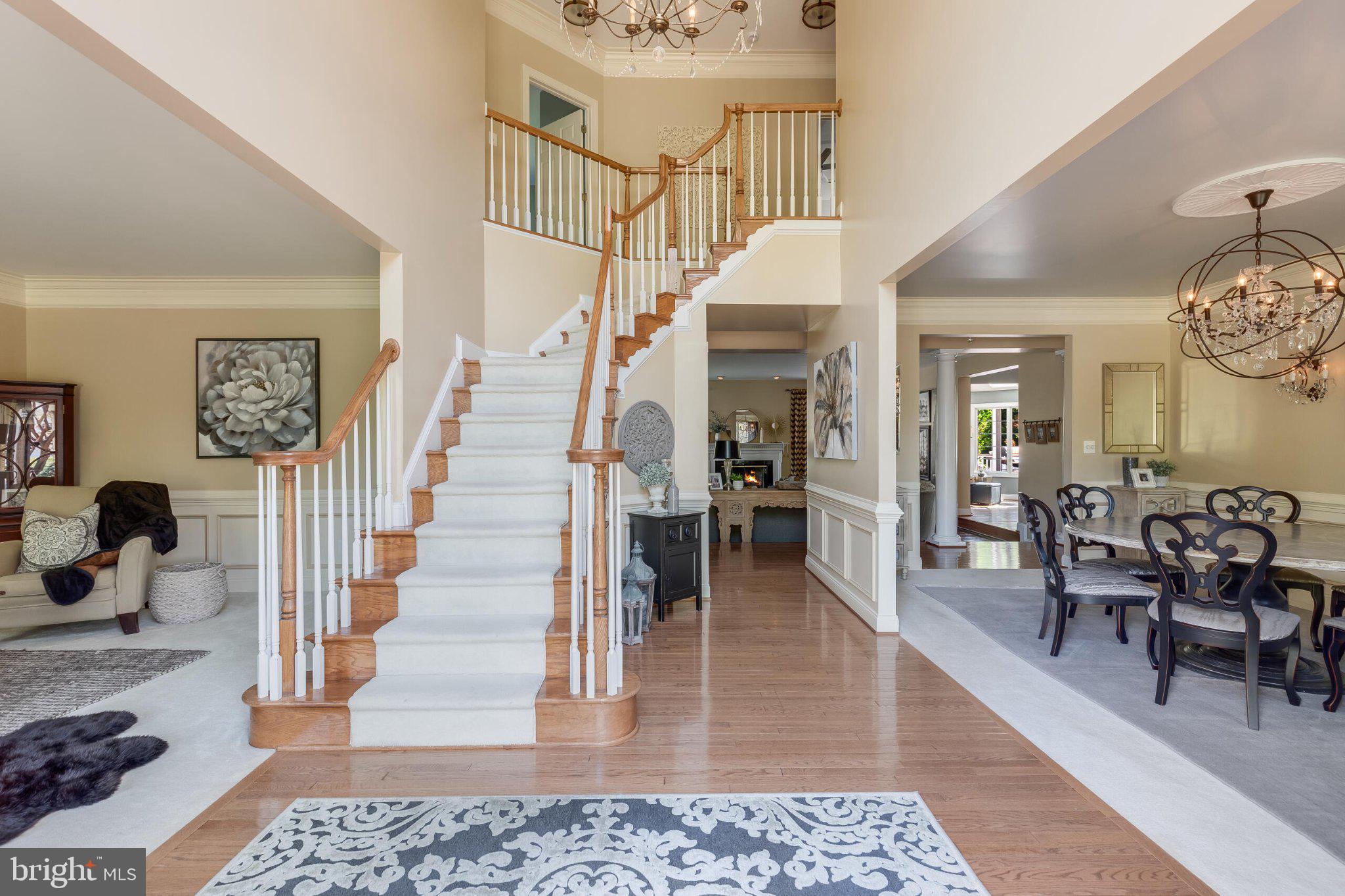 25554 Mimosa Tree Court Chantilly, VA 20152 - Photo 9 of 85 Elegant foyer with sweeping staircase.