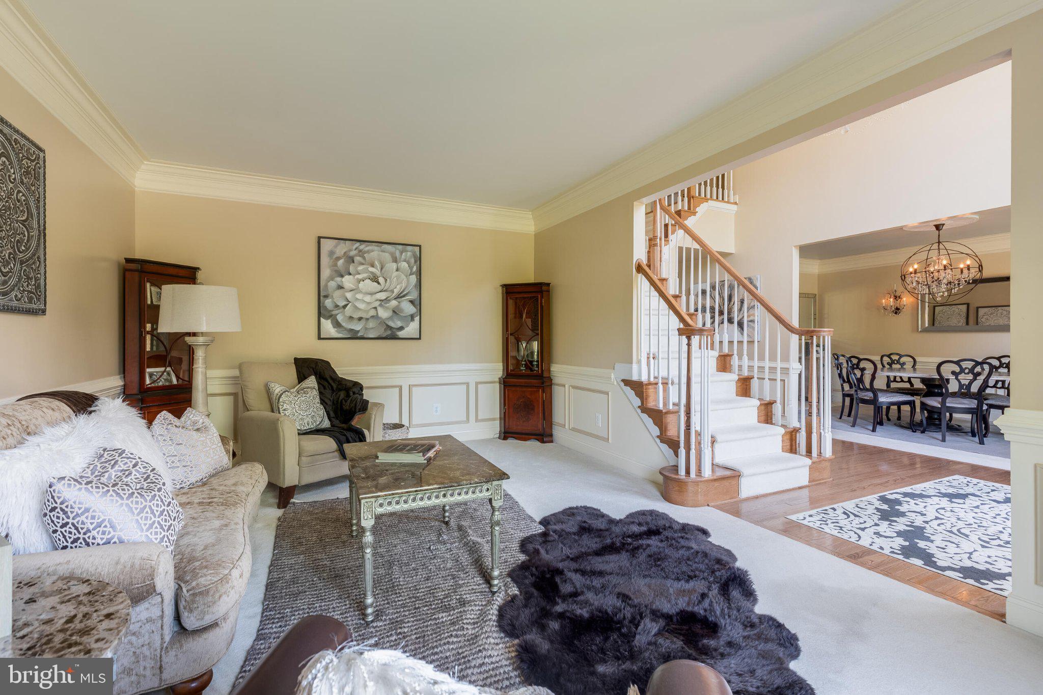 25554 Mimosa Tree Court Chantilly, VA 20152 - Photo 10 of 85 a living room with furniture and a rug