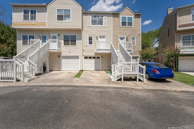a building with car parked in front of it