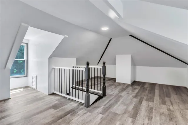 a view of a hallway with stairs