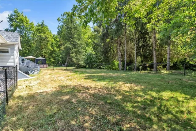 a view of backyard with green space