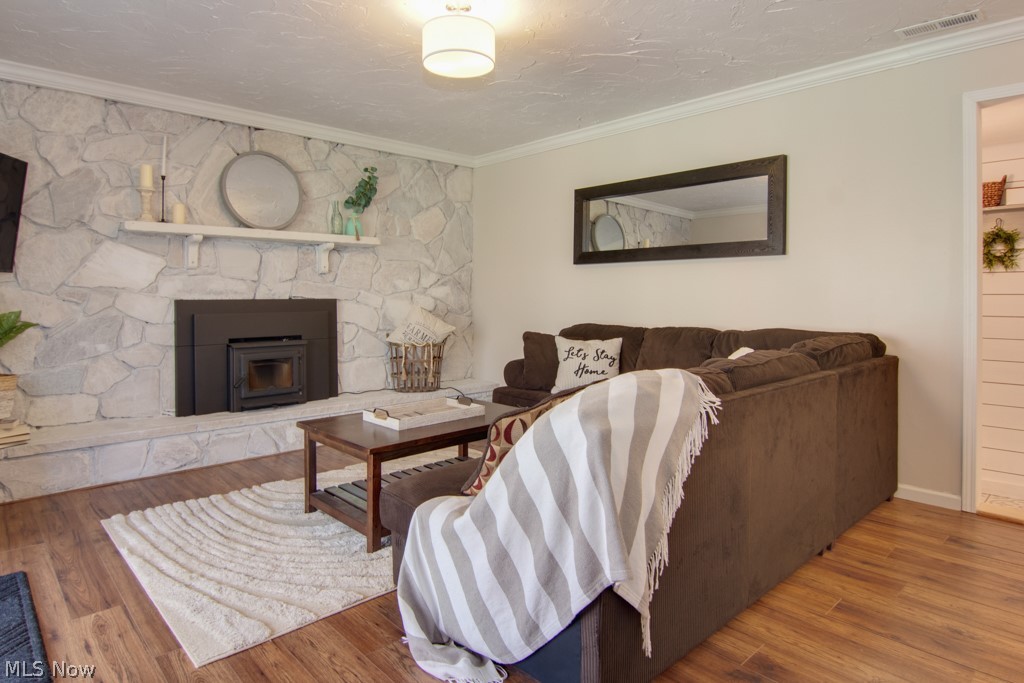 12945 Chamberlain Road Aurora, OH 44202 - Photo 18 of 30 Family Room with Stone Fireplace, and wood burning Fireplace Insert, Coat space, Half Bath and Laundry complete this Level