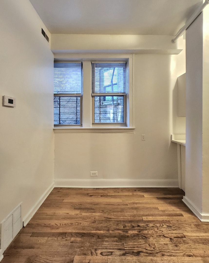 3746 West Irving Park Road, Unit GDN Chicago, IL 60618 - Photo 7 of 11 a view of a room that has a window in it