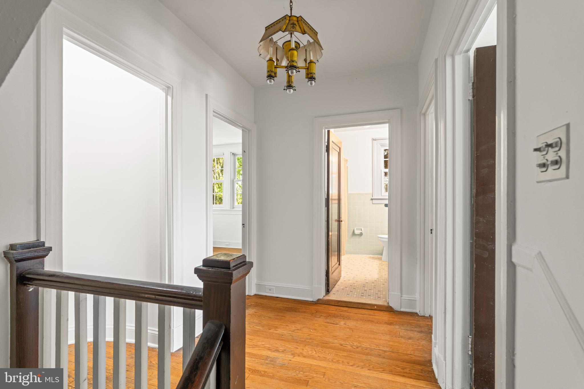309 Hopkins Road Baltimore, MD 21212 - Photo 14 of 36 a view of a hallway with wooden floor and stairs