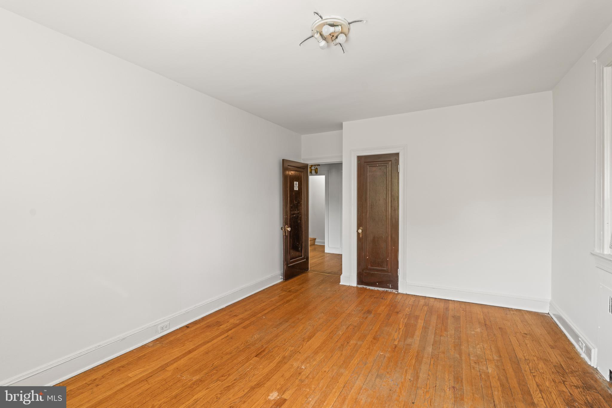 309 Hopkins Road Baltimore, MD 21212 - Photo 22 of 36 a view of an empty room with wooden floor
