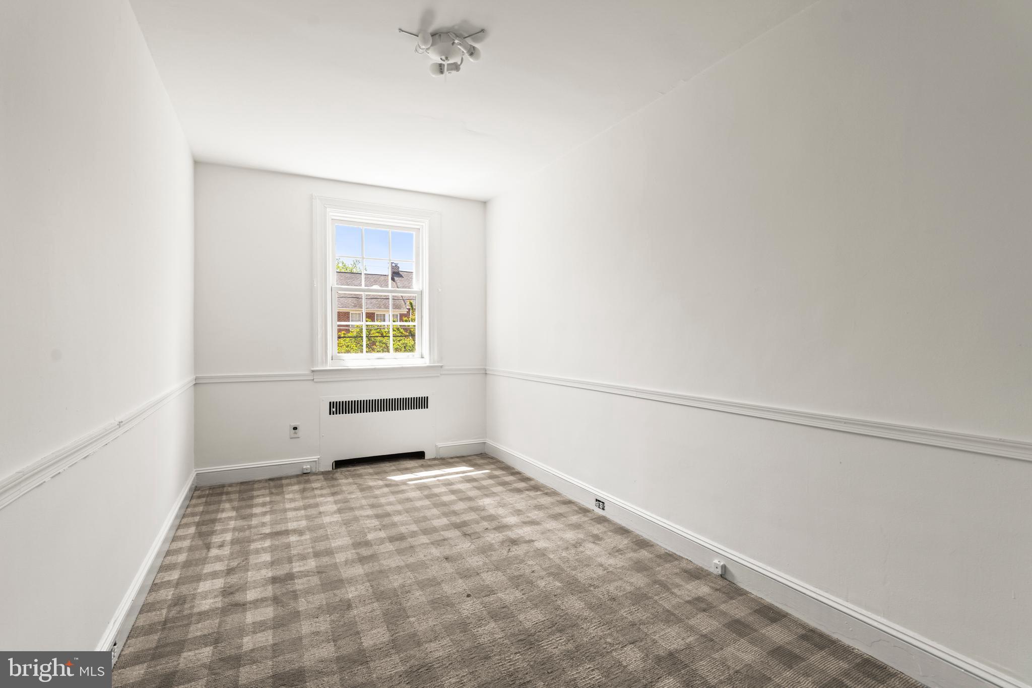 309 Hopkins Road Baltimore, MD 21212 - Photo 23 of 36 a view of an empty room with a window