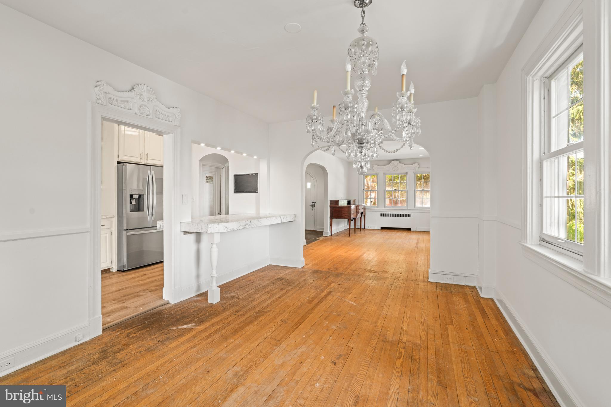309 Hopkins Road Baltimore, MD 21212 - Photo 8 of 36 a view of a room with wooden floor and windows