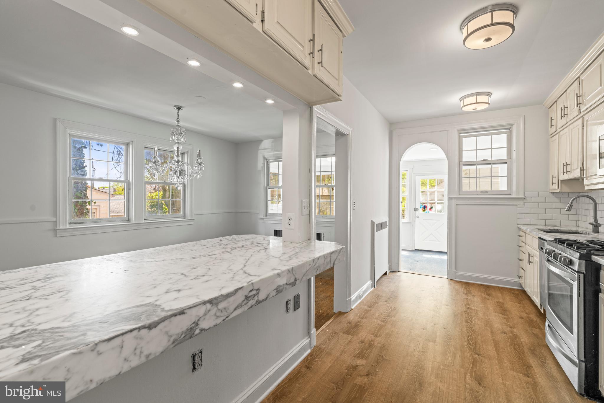 309 Hopkins Road Baltimore, MD 21212 - Photo 10 of 36 a spacious bathroom with a granite countertop tub sink and mirror