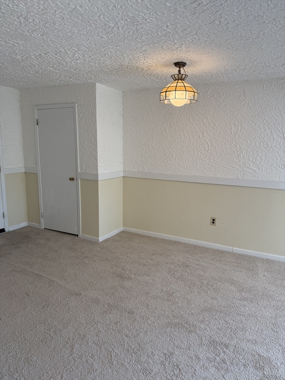 310 Codman Hill Road, Unit 34D Boxborough, MA 01719 - Photo 14 of 17 a view of an empty room with a window