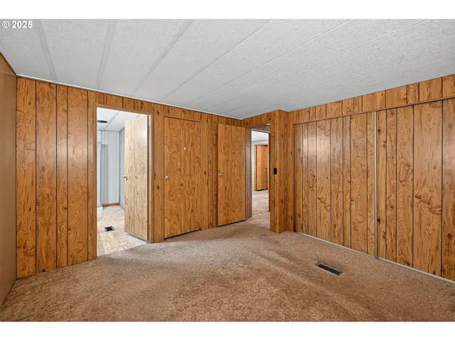 a bathroom with a sink vanity granite tub shower and a mirror
