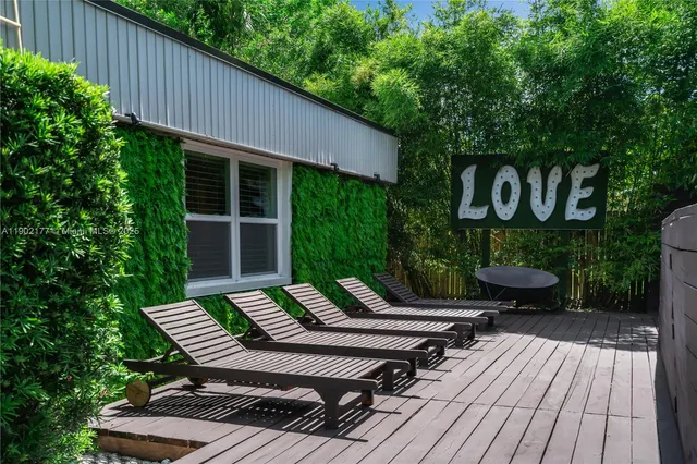 a view of a backyard with sitting area