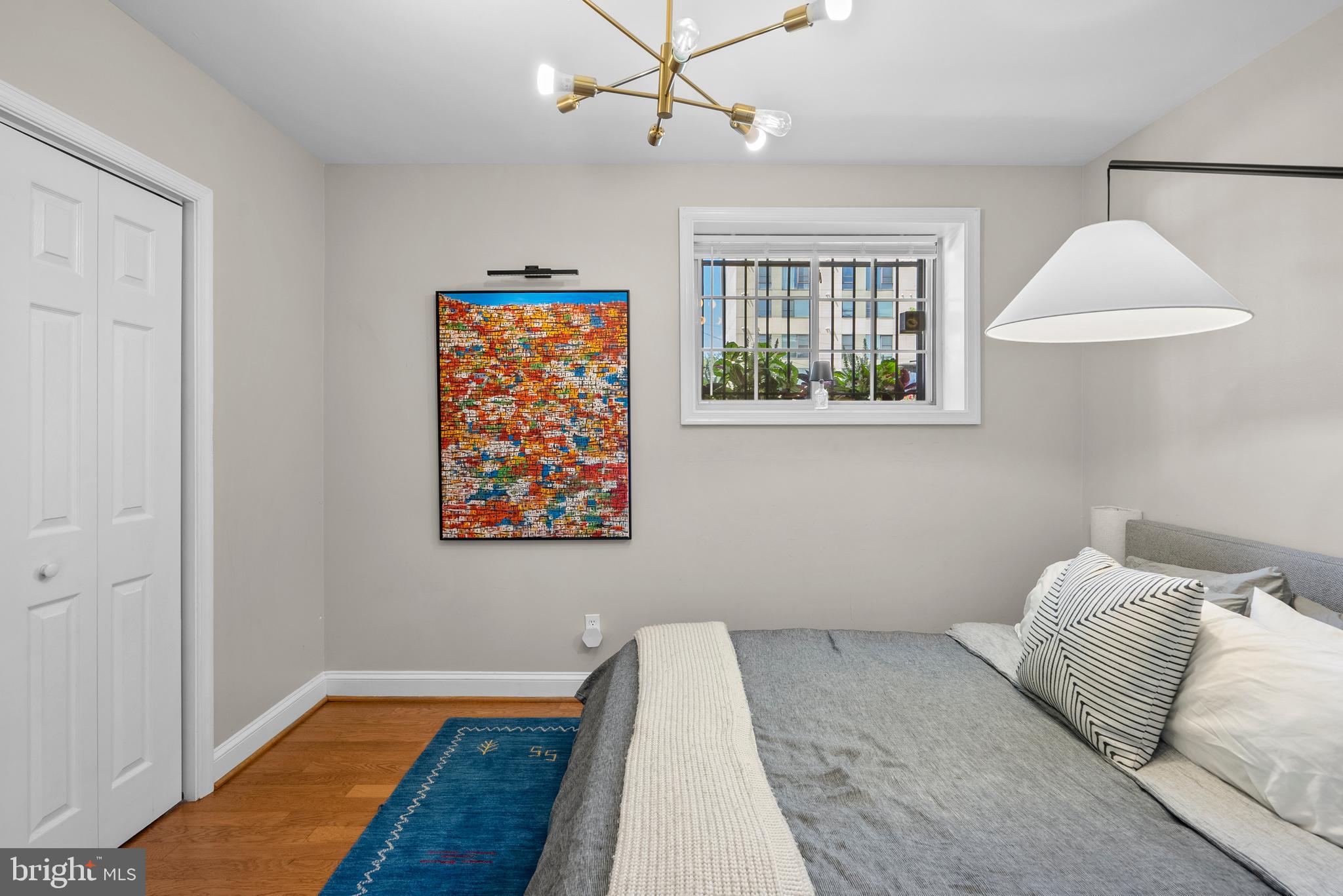 718 Park Road Northwest, Unit 1 Washington, DC 20010 - Photo 22 of 28 a bedroom with a bed and a lamp