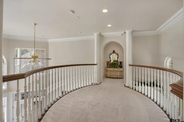 a view of a hallway view with staircase
