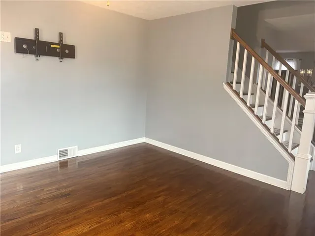 a view of a utility room with wooden door and a wooden bench