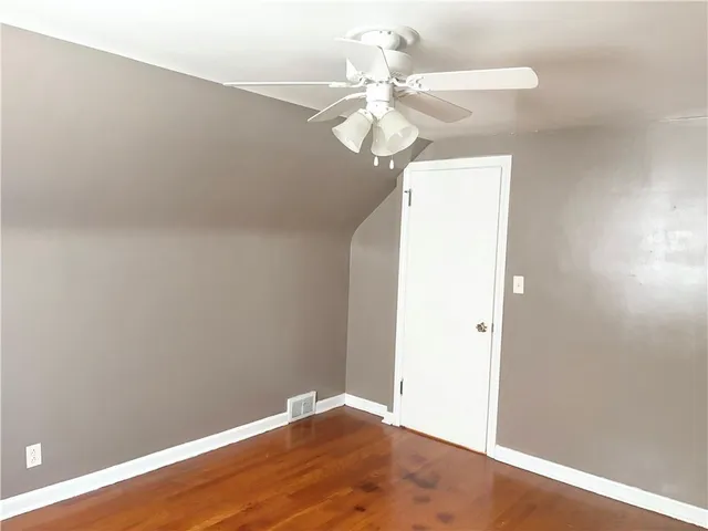 a view of kitchen with furniture and wooden floor